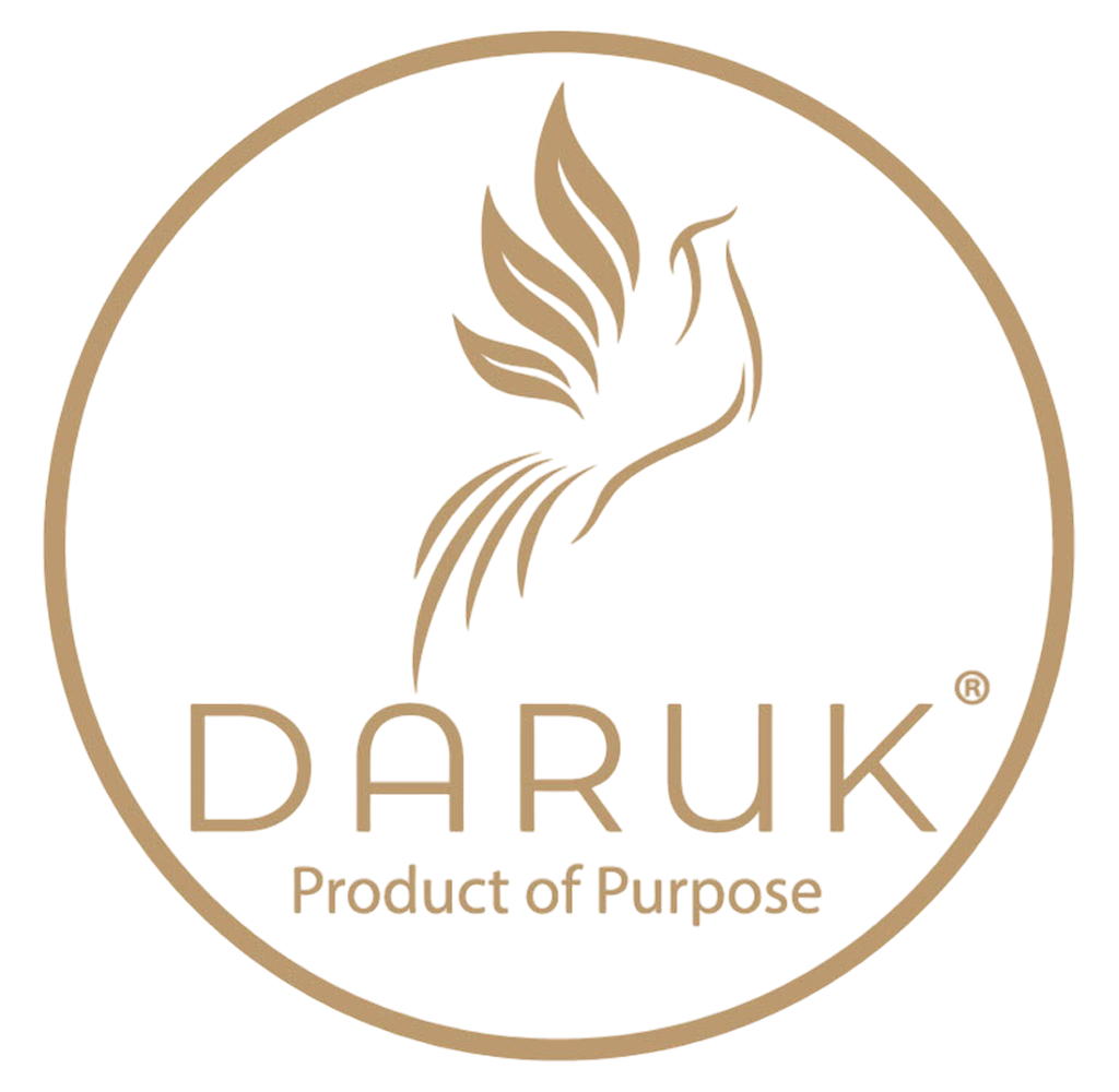 Daruk primary mark — gold phoenix-rising icon inside a thin gold circle above the DARUK® wordmark and 'Product of Purpose' tagline
