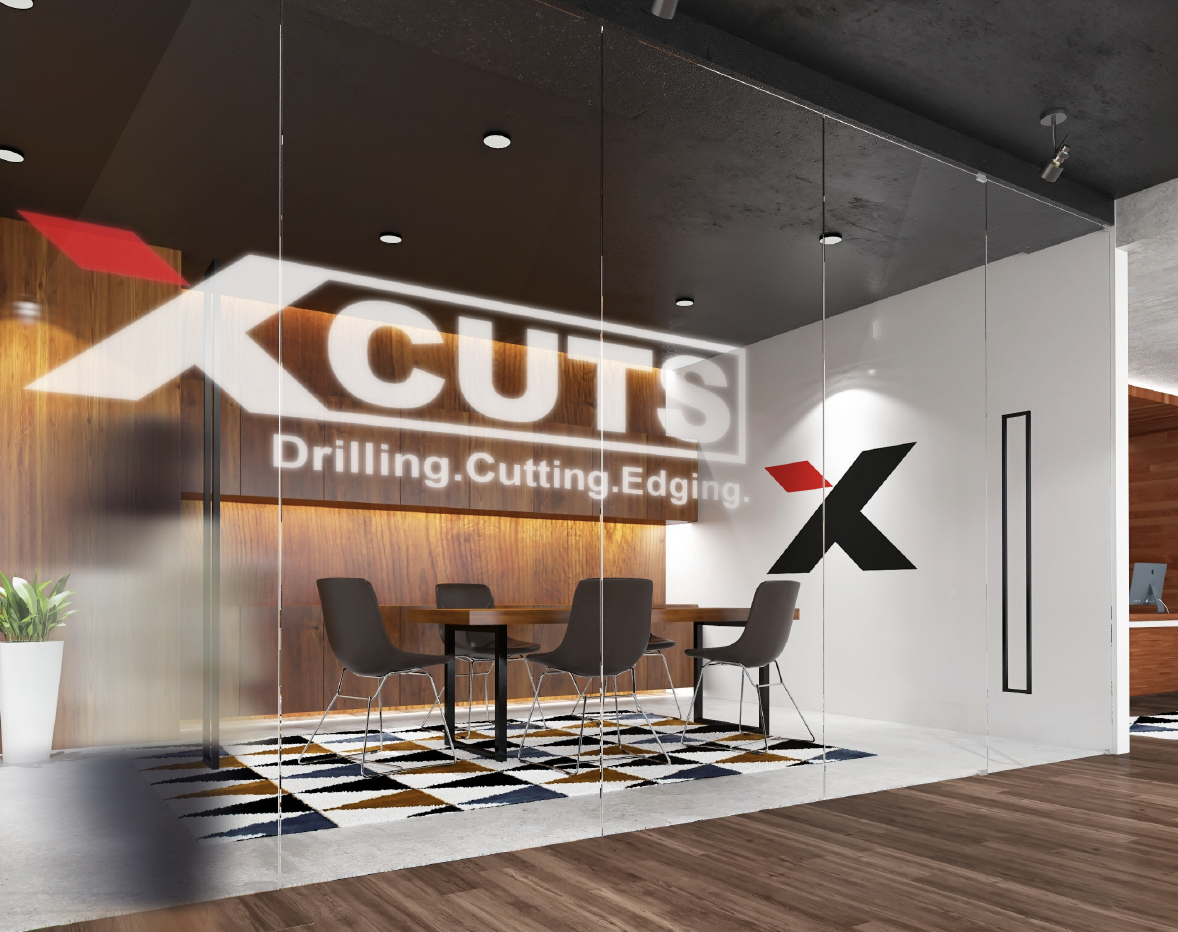 XCuts environmental signage — a glass meeting room with frosted XCuts Drilling Cutting Edging vinyl and a large red and charcoal X mark on a timber-panel reception wall